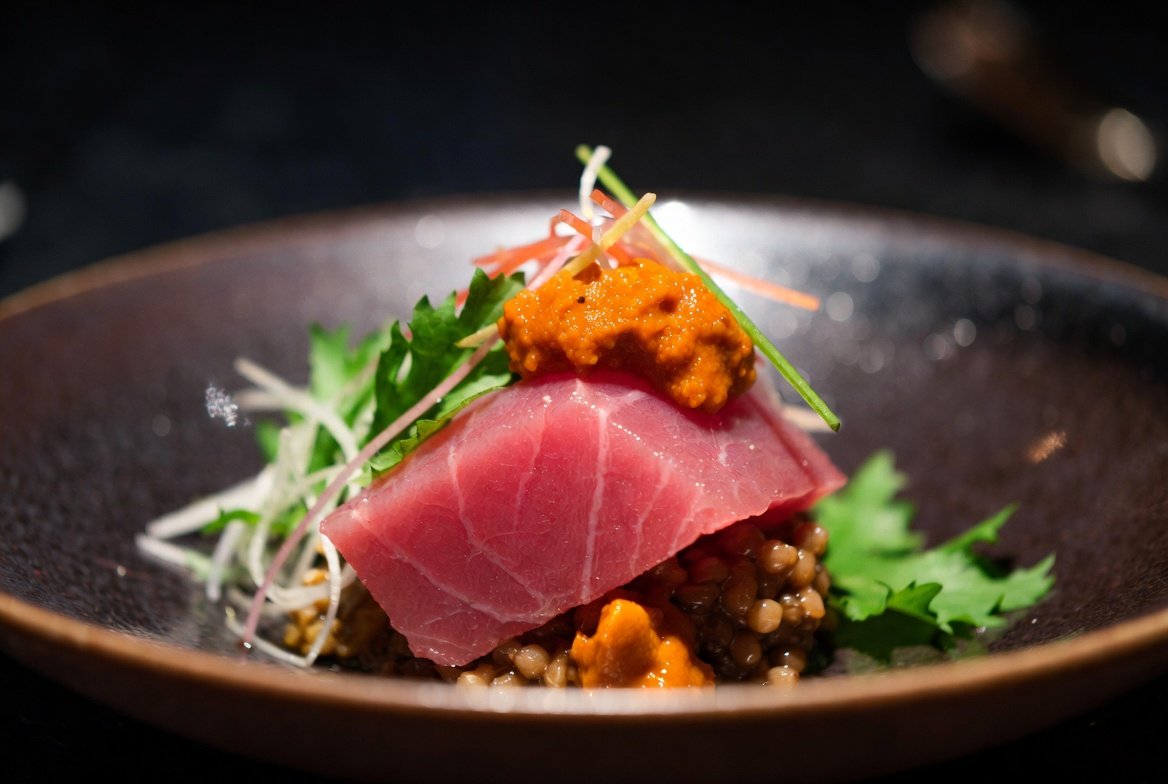 Chef preparing sushi in a Tokyo Michelin star restaurant Ginza